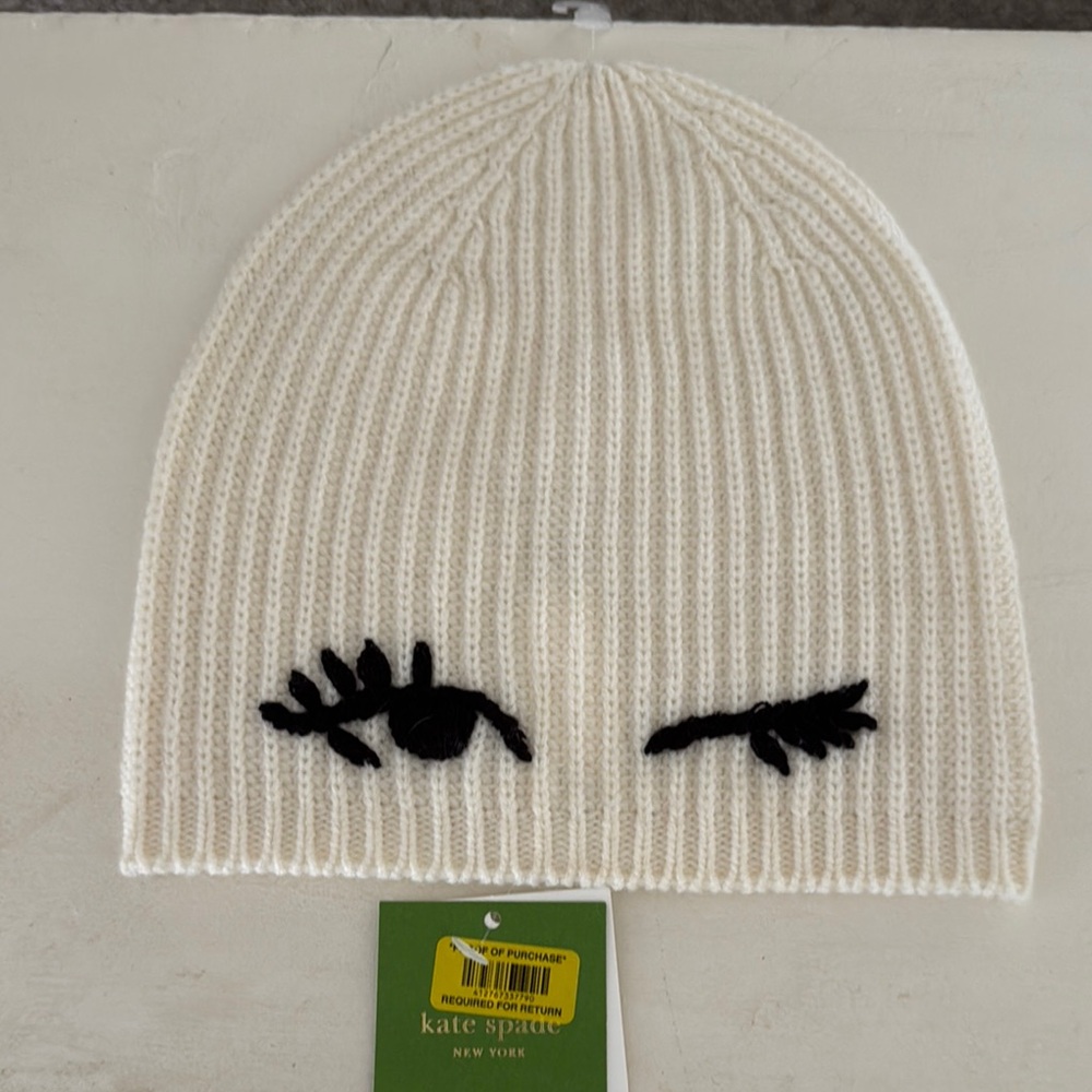 Kate Spade Cream Beanie with Black Eyelash Design